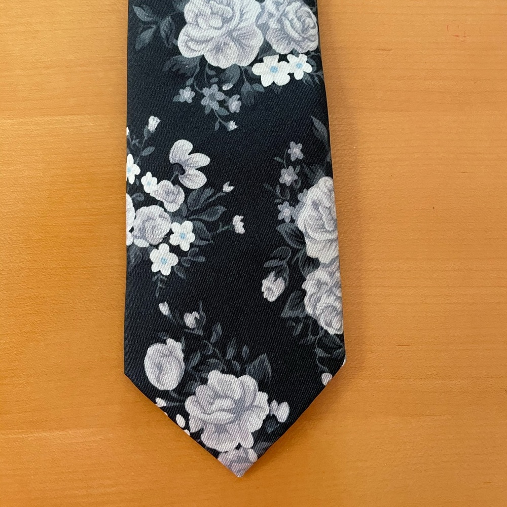 100 % silk dark blue with grey floral. wide tie